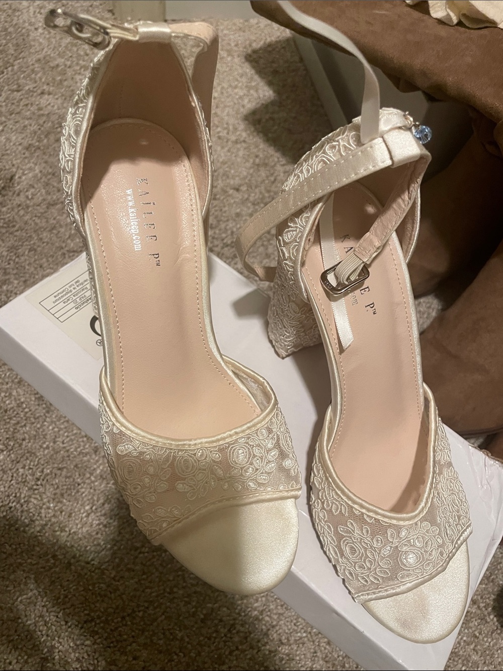 Embossed Cream Ankle-Strap Block Heels by Badgley Mischka
